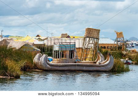 Traditional village on floating islands on lake Titicaca in Peru South America