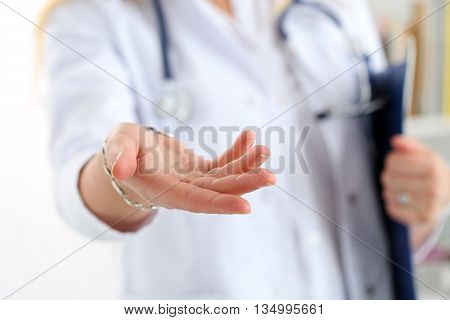 Female Medicine Doctor Offering Helping Hand Closeup