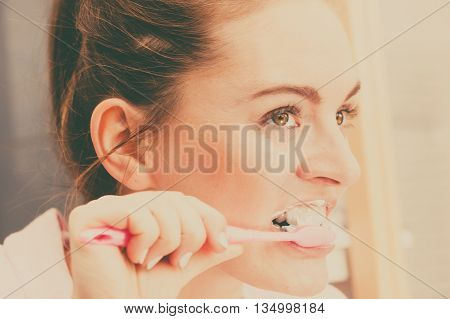 Woman Brushing Cleaning Teeth In Bathroom