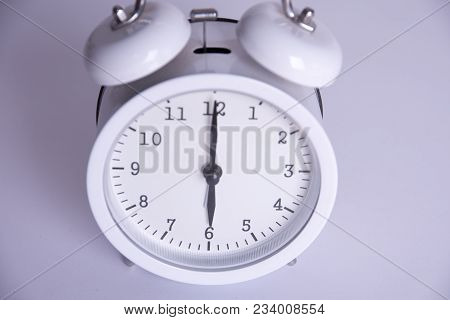 Clock From Six O'clock On A White Background