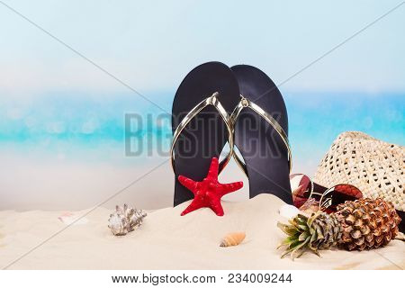 Flip Flops, Hat, Mini Pineapple And Sunglesses On Sandy Beach. Travel, Vacation, Holidays Background