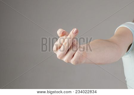 Woman Hand Showing Middle Finger On A White Isolated Background