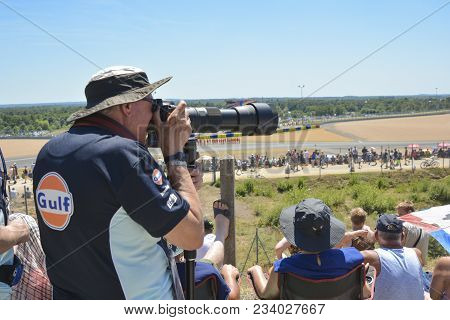 Le Mans, France - June 18, 2017: Professional Photographer Taking A Photo Off A Race Road With Big C