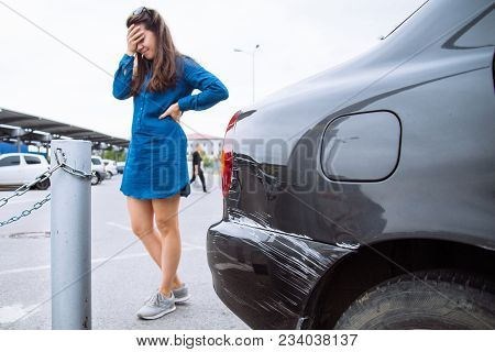 Sad Woman Near Scratched Car. Car Dent. Copy Space.auto Insurance