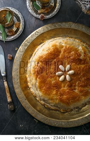 Top View Of Bastilla, Layered Moroccan Pie With Chicken.