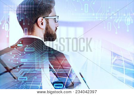 European Businessman On Abstract Circuit Background With Copy Space. Computing And Engineering Conce