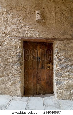 Ancient Stone Bricks Wall And Old Wooden Door At The Monastery Of Saint Paul The Anchorite, Egypt