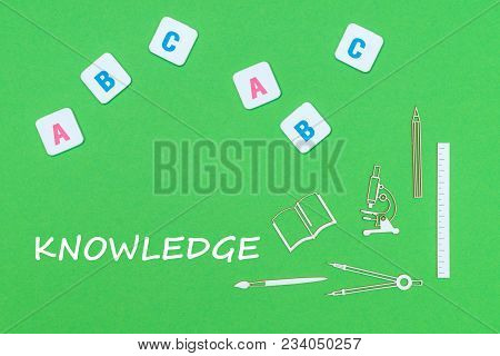 Concept School, Text Knowlwdge, From Above School Supplies Wooden Minitures, Abc Letters On Green Ba
