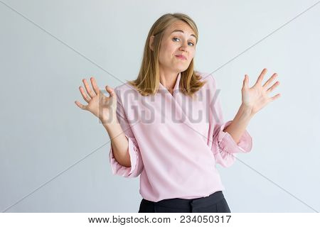 Indifferent Lady Expressing Non-involvement And Spreading Out Hands. Funny Emotional Woman Does Not 