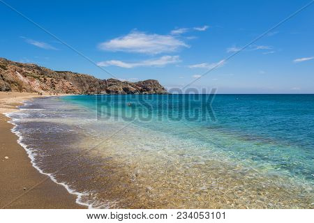 Beach With Crystal Sea Water In Paleochori Bay On Milos Island In Greece.