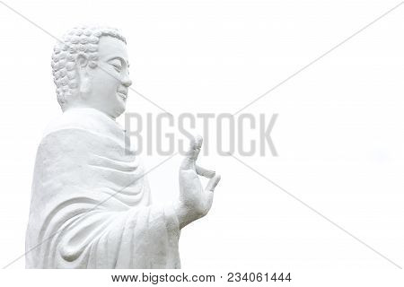 Statue Of Buddha Standing Hand Raised In Gesture Of Vitarka Mudra