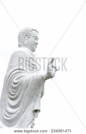 Statue Of Buddha Standing Hand Raised In Gesture Of Vitarka Mudra