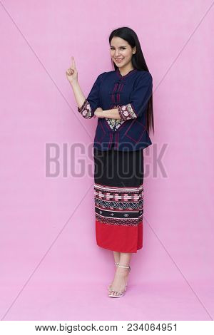 Portrait Beautiful Asian Girl In Traditional Thai Dress Isolated On Pink Background. 
Cotton Dress