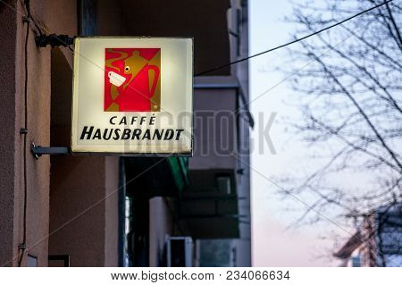 Belgrade, Serbia - March 25, 2018: Caffe Hausbrandt Logo Lit On A Cafe Bar Of Belgrade, During The E