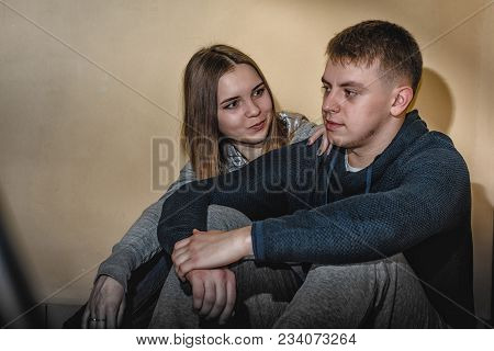 Adult Teenagers Boyfriend And Girlfriend Hugging Each Other In The Corridor Of An Apartment Building