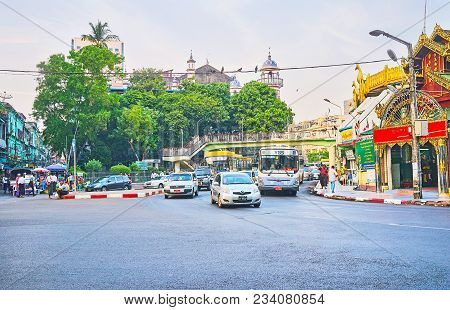 Yangon, Myanmar - February 14, 2018: The Traffic On The  Roundabout Road Between Sule Pagoda And Ben