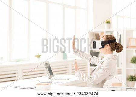 Businesswoman gesturing while using virtual reality simulator