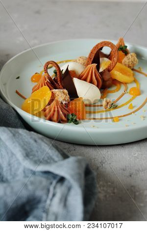 Dessert On A Plate. High Kitchen. Non-standard Feed. French Dessert. Tart Of Shortcake With Apricot 