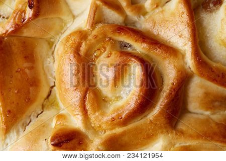Homemade Rose Bread With Raisins Over White Textured Background, Close-up, Top View, Shallow Depth O