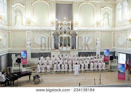SAINT-PETERSBURG, RUSSIA - FEBRUARY 25, 2018: Children's Choir Little Masters from Moscow, Russia performs during V Children and Youth World Choral Championship. First championship was held in 2011