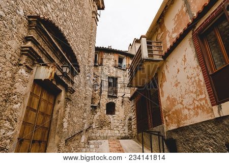 Bottom View Of Narrow Street With Ancient Buildings At Old Town, Peille, France