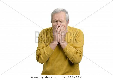Portrait Of Senior Man Coughing. Sick Old Man In Yellow Wool Sweater. White Isolated Background.