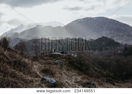 Unidentified People On A Viewing Platform Near Glenfinnan Viaduct, Scotland. The Viaduct Is Featured