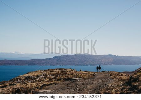 Isle Of Skye, Scotland - March 19, 2018: Couple Walking The Old Man Of Storr Walk On Skye, Mountains