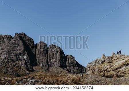 Isle Of Skye, Scotland - March 19, 2018: People Walking The Old Man Of Storr Walk On Skye, Mountains