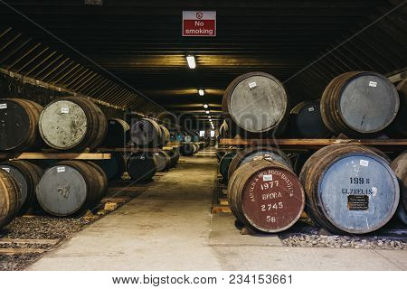 Brora, Scotland - March 22, 2018: Barrels Of Whisky Inside Brora Distillery Warehouse In Scotland, R