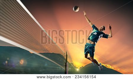 Professional Volley Player In Action At The Sunset