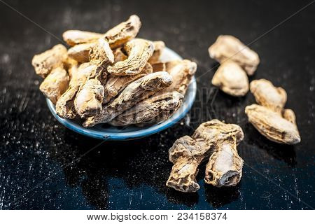 Close Up Of Ayurvedic Herb Or Folk Medicine Dried Ginger Or Zingiber Officinale In A Glass Plate On 