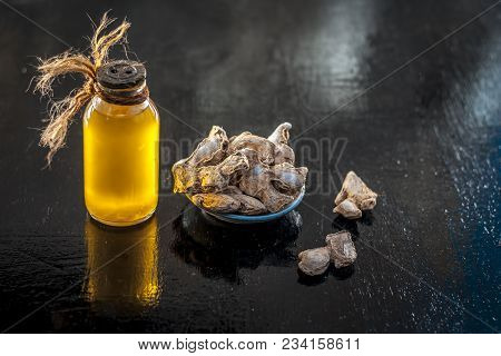 Close Up Of Ayurvedic Herb Or Folk Medicine Dried Ginger Or Zingiber Officinale With Common Cooking