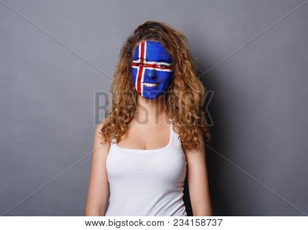 Portrait Of A Woman With The Flag Of Iceland Painted On Her Face. Football Or Soccer Team Fan, Sport