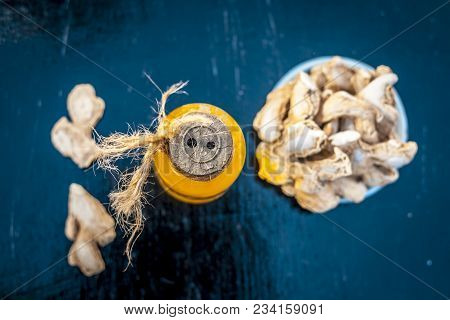 Close Up Of Ayurvedic Herb Or Folk Medicine Dried Ginger Or Zingiber Officinale With Common Cooking