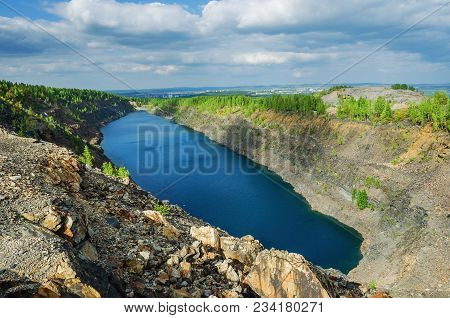 Dinas An Abandoned Quarry Filled With Water. Russia, Sverdlovsk Region, Pervouralsk City
