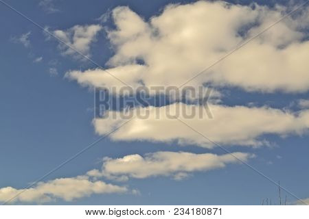 Blue April Sky With Light White Clouds Natural Background