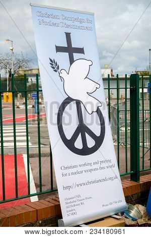 Aldermaston, United Kingdom, 1st April 2018:- Cnd Peace Banners By The Main Gate To The Awe Where Br