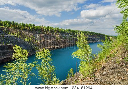 Dinas An Abandoned Quarry Filled With Water. Russia, Sverdlovsk Region, Pervouralsk City
