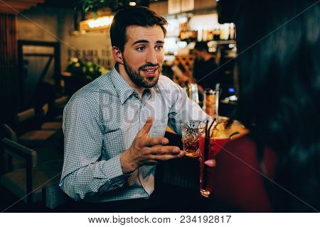 Handsome Guy Is Talking To Girl He Likes. He Is Full In Making Conversation With Her. Both Of Them H