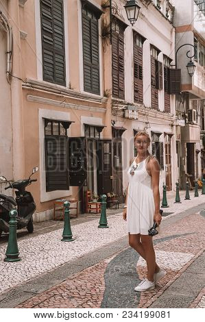 Macao, China. August 26, 2017. Girl On The Senado Square, A Paved Town Square And A Part Of The Unes
