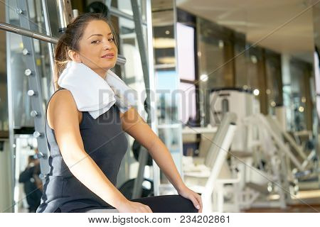 Girl With A Towel Around Her Neck In The Gym. Healthy Lifestyle, Gymnastics, Weightloss Concept