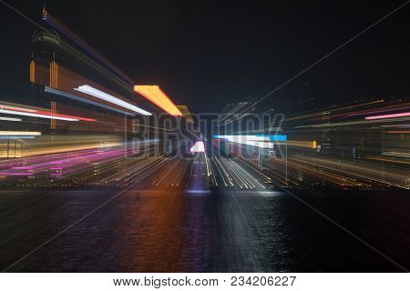 Hong Kong's Victoria Harbor And Commericial Island Illuminated In And Abstract Urban Image Of City N