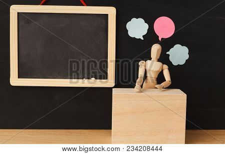 Wooden Man Figure Mannequin With Blank Speech Bubbles On Black Background With Empty Chalkboard, Obj