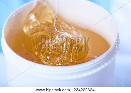 A Pack Of Stretchy Golden Luminous Sugaring Paste, Close-up