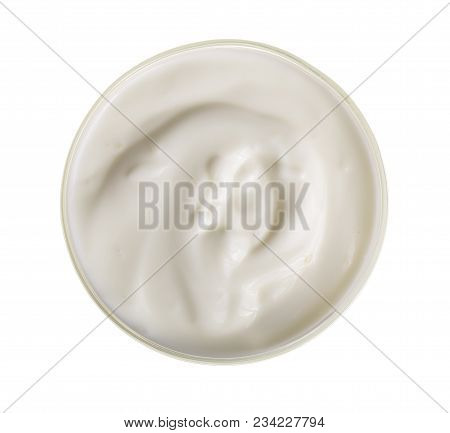 Bowl Of Yogurt Isolated On White Background Top View.