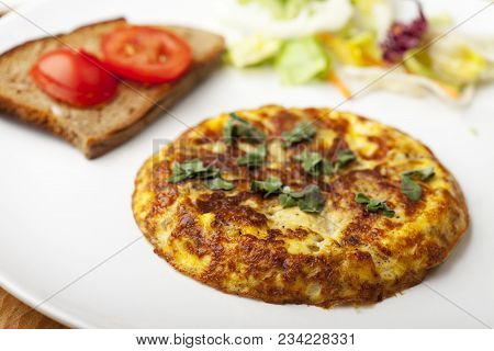 Closeup Of A Tortilla Espagnola With Salad