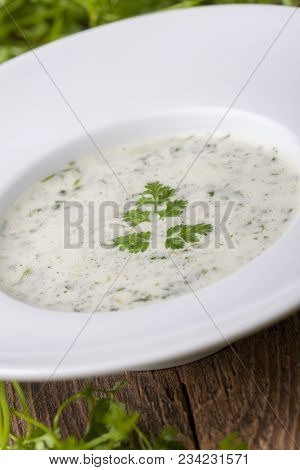 Fresh Chervil Soup In A Bowl On Wood
