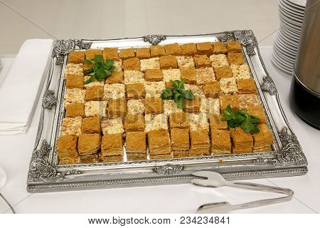 A Lot Of Pieces Of Fresh Honey Cakes, On A Iron Tray. Event Catering Service, Top View