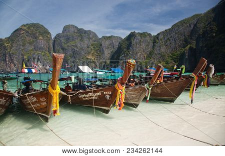 KO PHI PHI LEH, THAILAND, February 1, 2014: Overcrowded beach of Maya Bay, Andaman Sea, famous tourist destination in the Ko Phi Phi achipelago